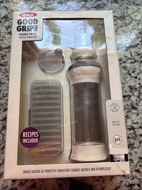 Oxo Good Grips Cookie Press with recipes and 12 discs. Used one time.
